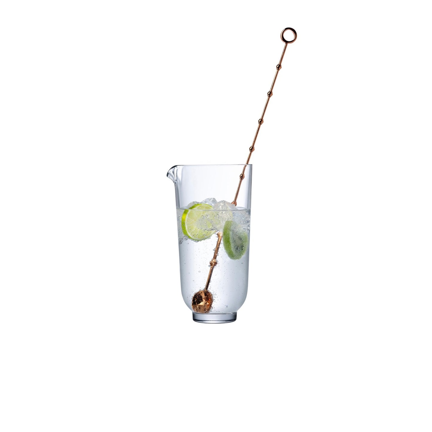 Elegant cocktail mixing glass with metal stirrer.