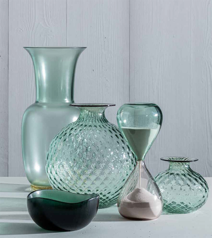Monofiori vase paired with similar colored objects, also available by Venini.