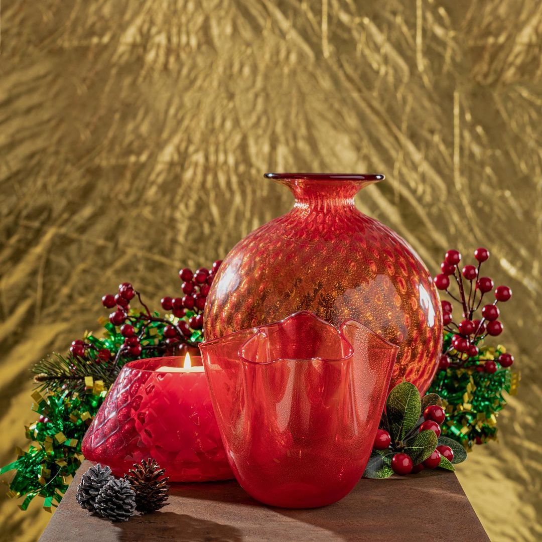 Holiday curation of the Monofiori Vase paired with the red Fazzoletto against Christmas decor.