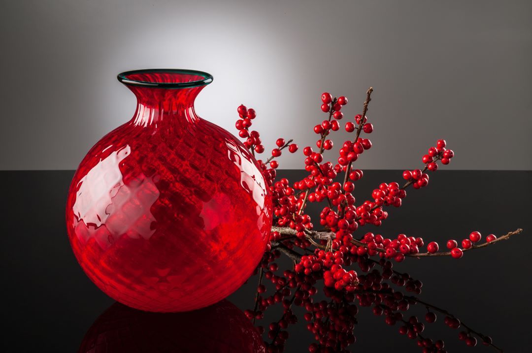 Red round etched glass with colored lip crafted from Murano, Italy.